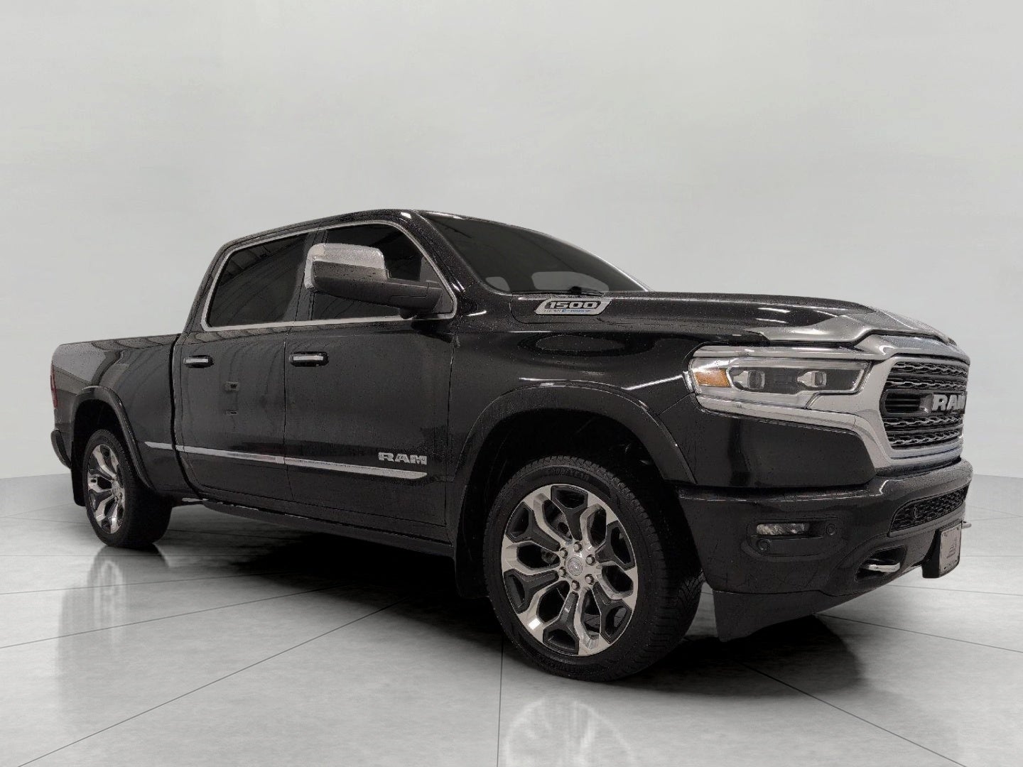 2021 RAM 1500 Limited 4x4 Crew Cab 6'4 Box in Diamond Black Crystal Pearlcoat — front three-quarter view