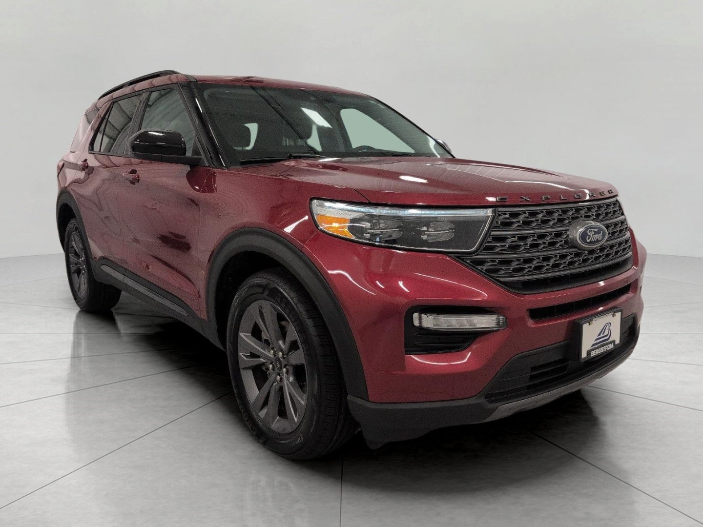 2024 Ford Explorer XLT 4WD in Rapid Red Metallic Tinted Clearcoat — front three-quarter view