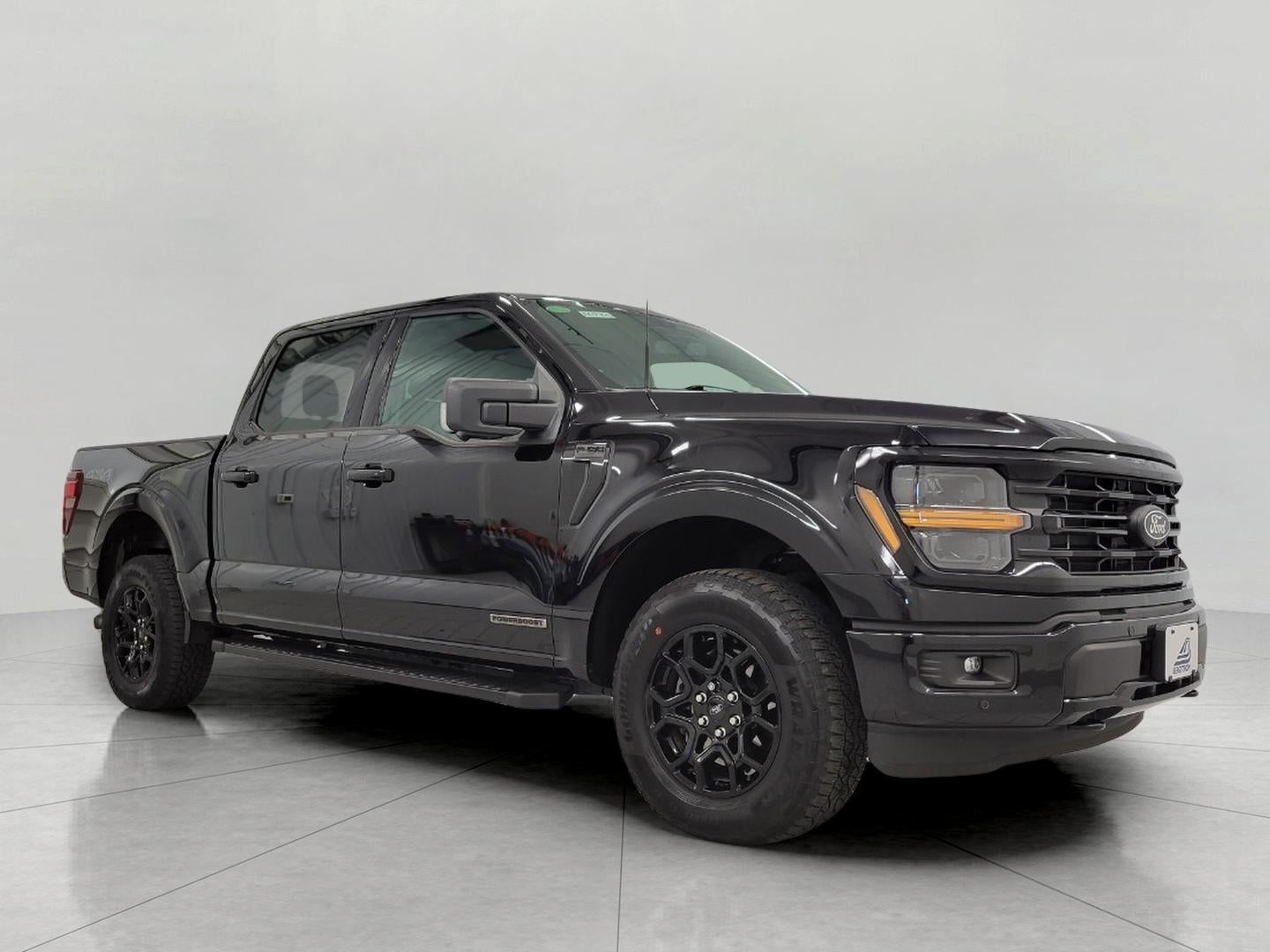 2024 Ford F-150 XLT in Agate Black Metallic — front three-quarter view